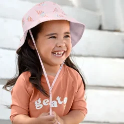 LÄSSIG Chapeau Anti-UV Réversible Ice Cream Rose Pâle - 7/12 Mois